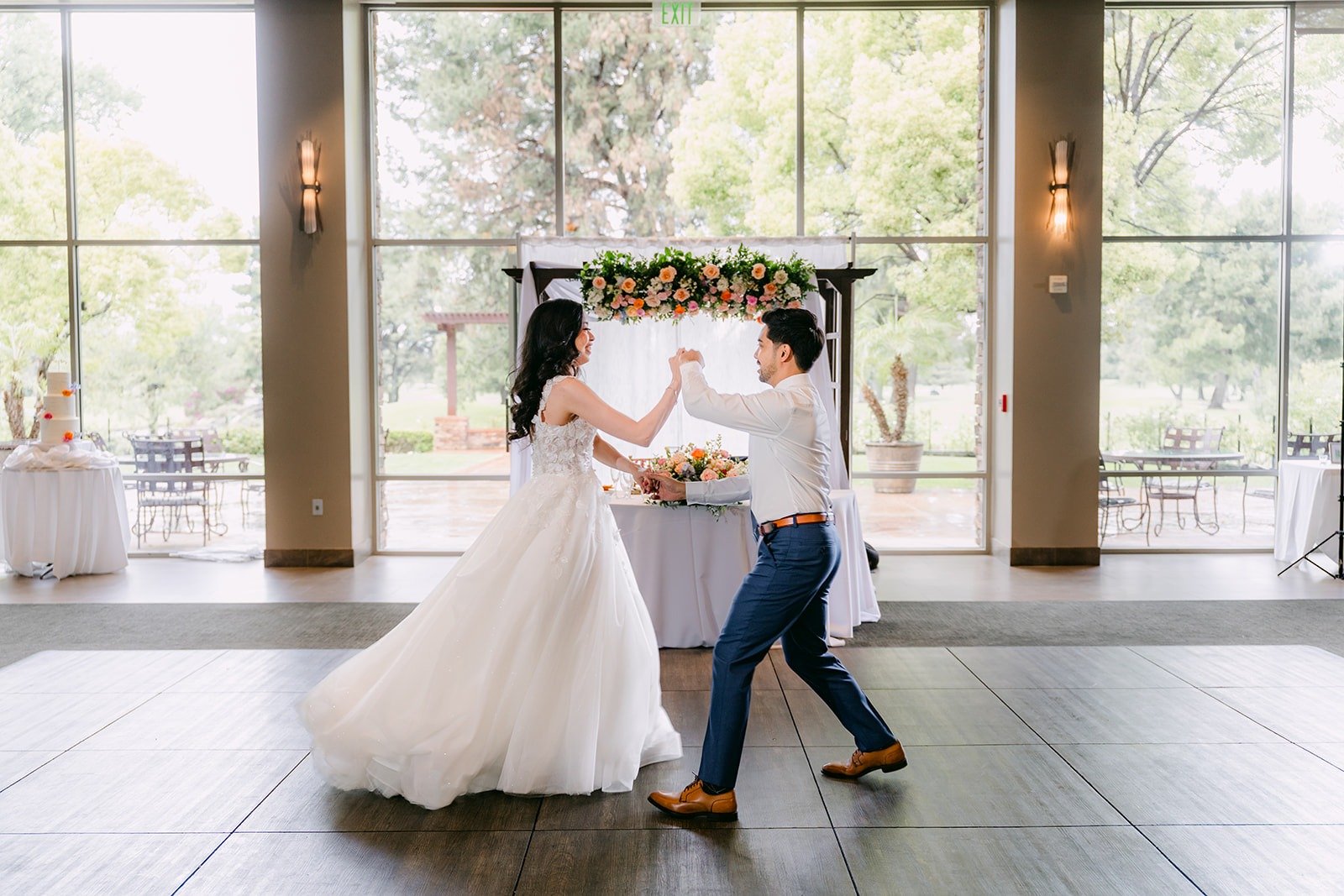 Mark spinning Natalie across the ballroom floor during their first dance