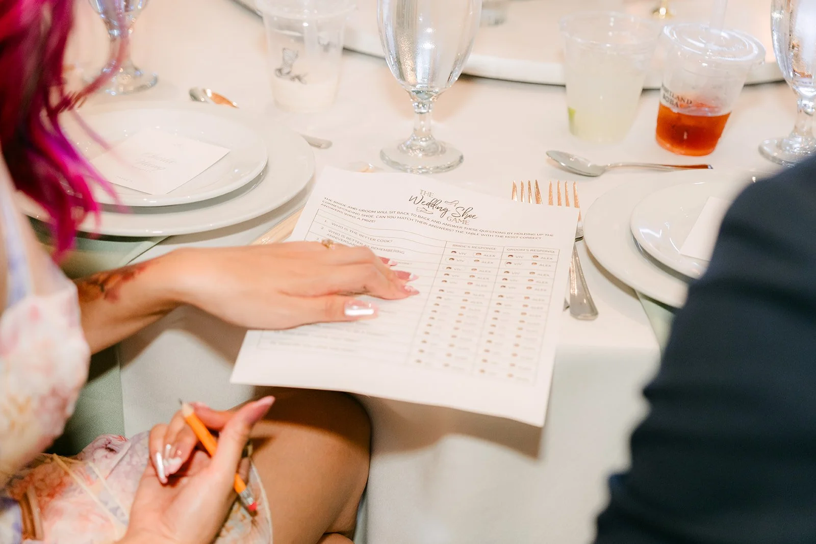 Guest filling out a game card at the reception