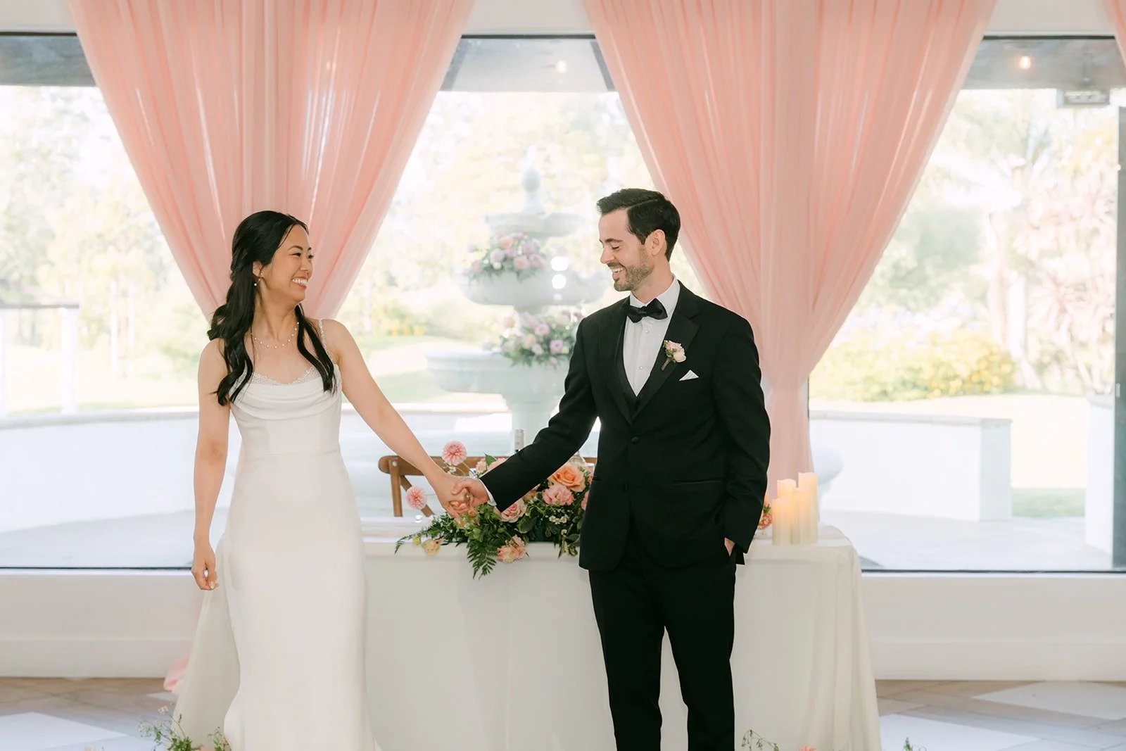 Stephanie and Kevin starting their first dance by the sweetheart table
