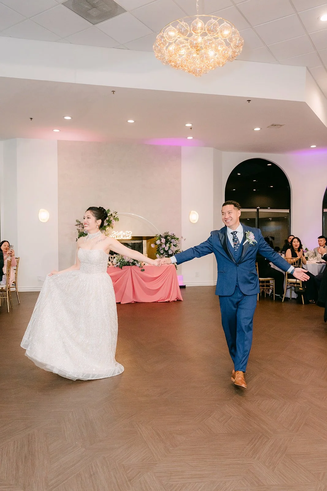 Kate and Michael dancing across the ballroom floor, photographed by One and Only Production.