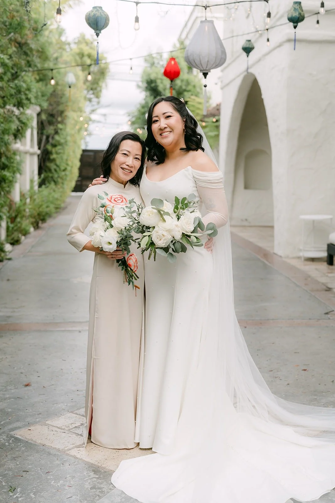 Vivian with a bridesmaid in the courtyard
