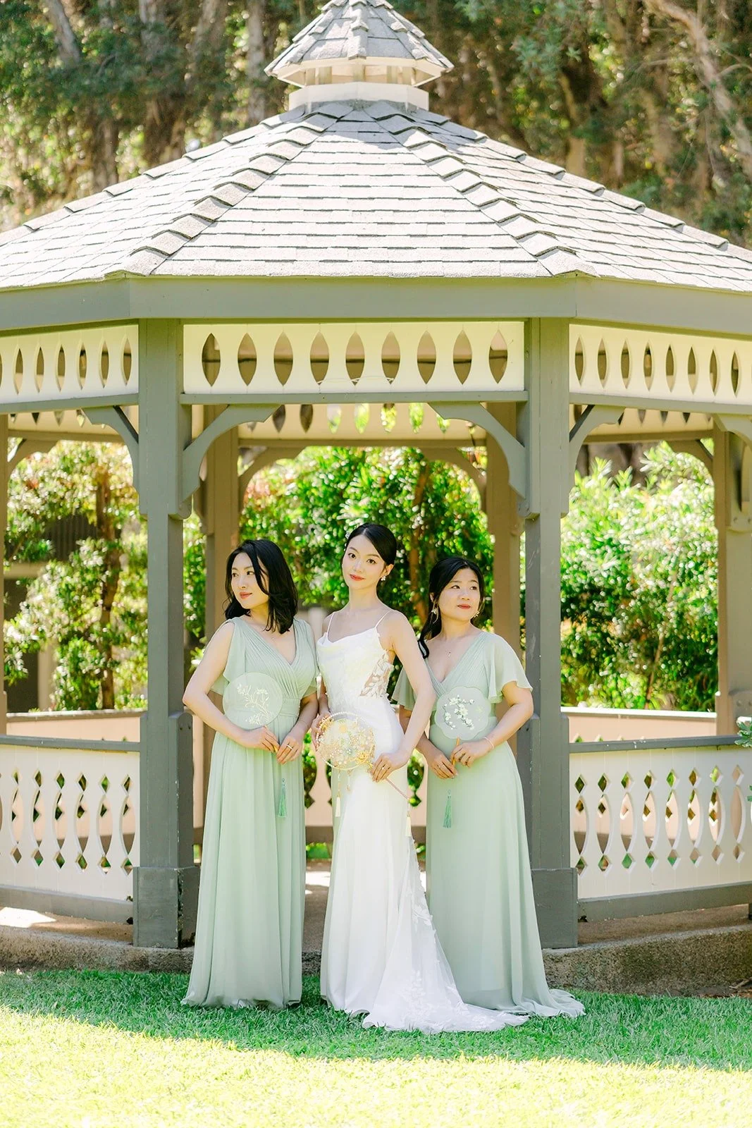 Tin and her bridesmaids in the white gazebo