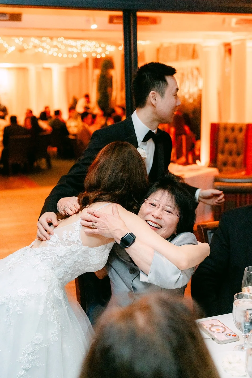 Valerie and Jason embracing guests at the reception