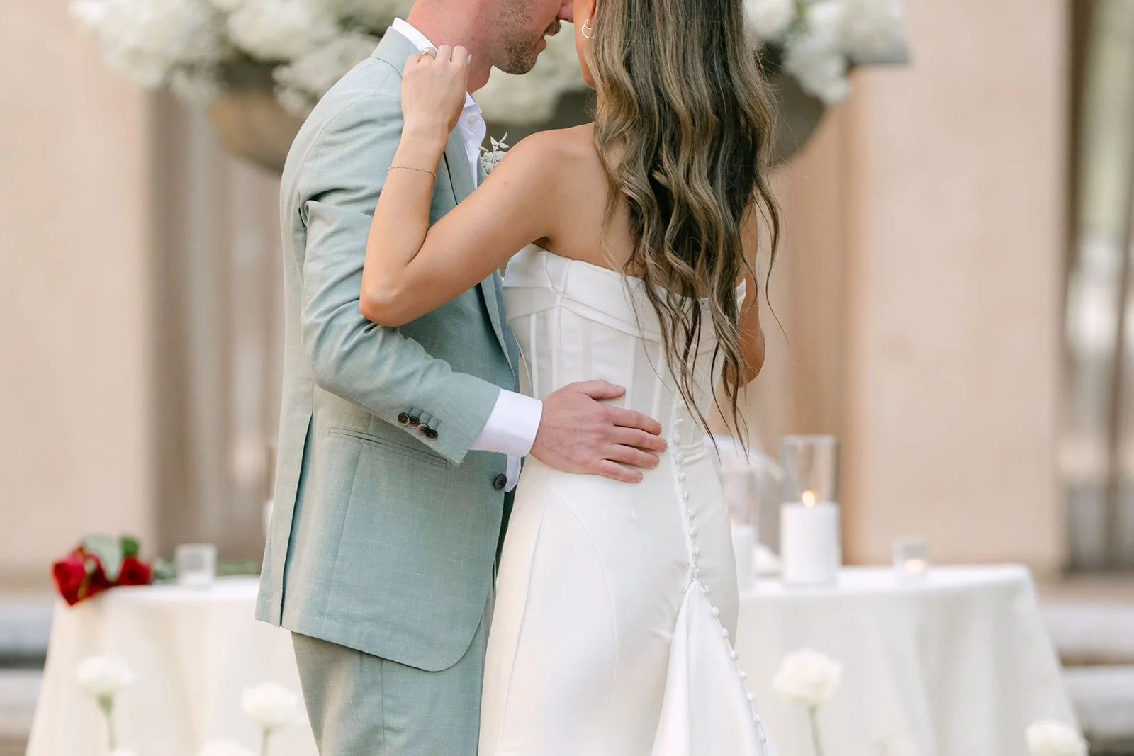 Kieu and Anthony holding each other close during their first dance
