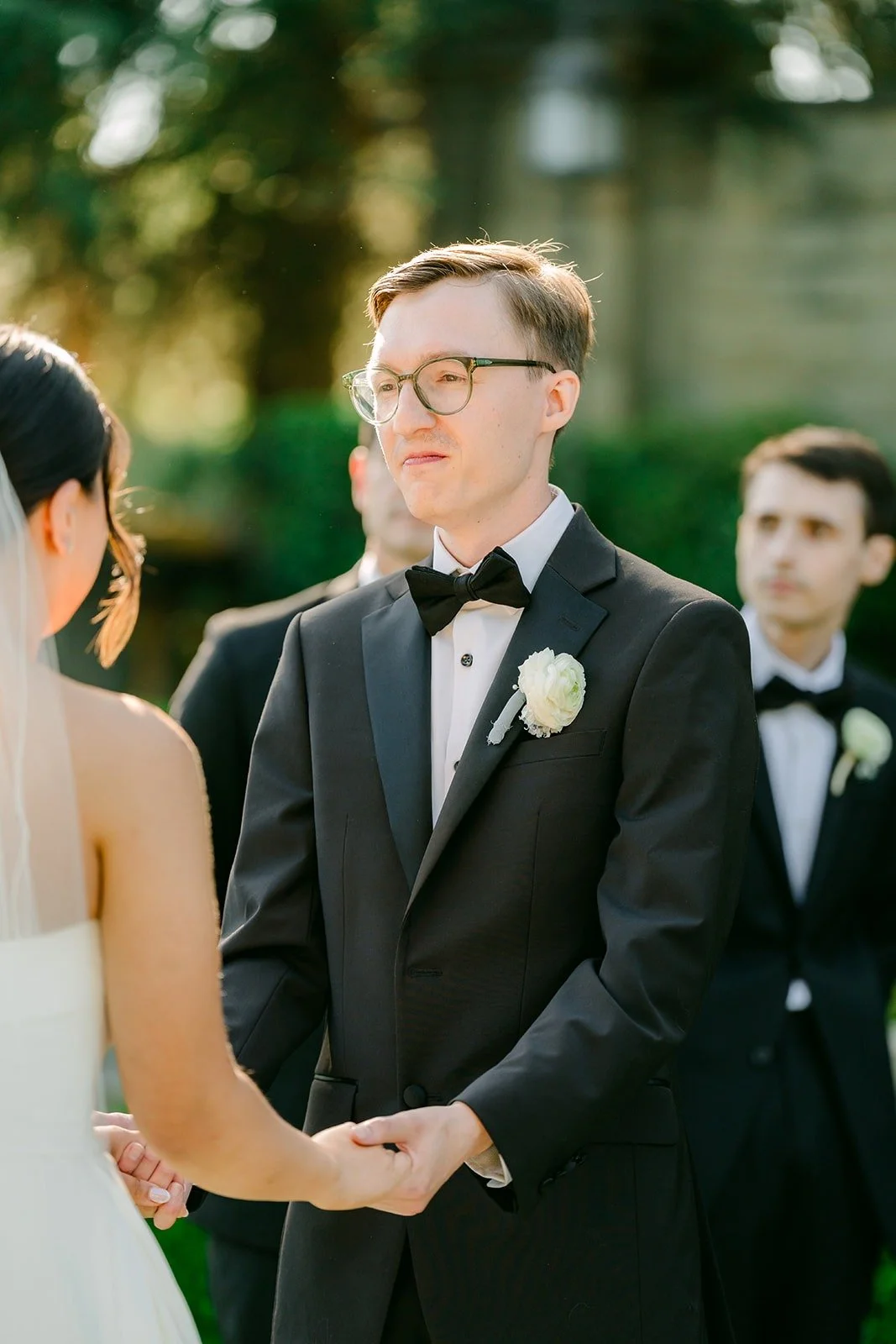 Nik smiling at Brianna during the ceremony