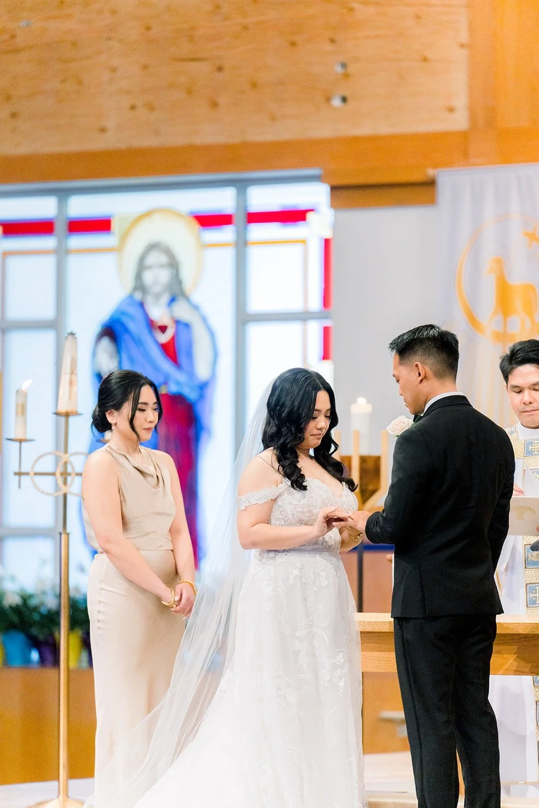 Ralph placing the ring on Francesca's finger at the altar