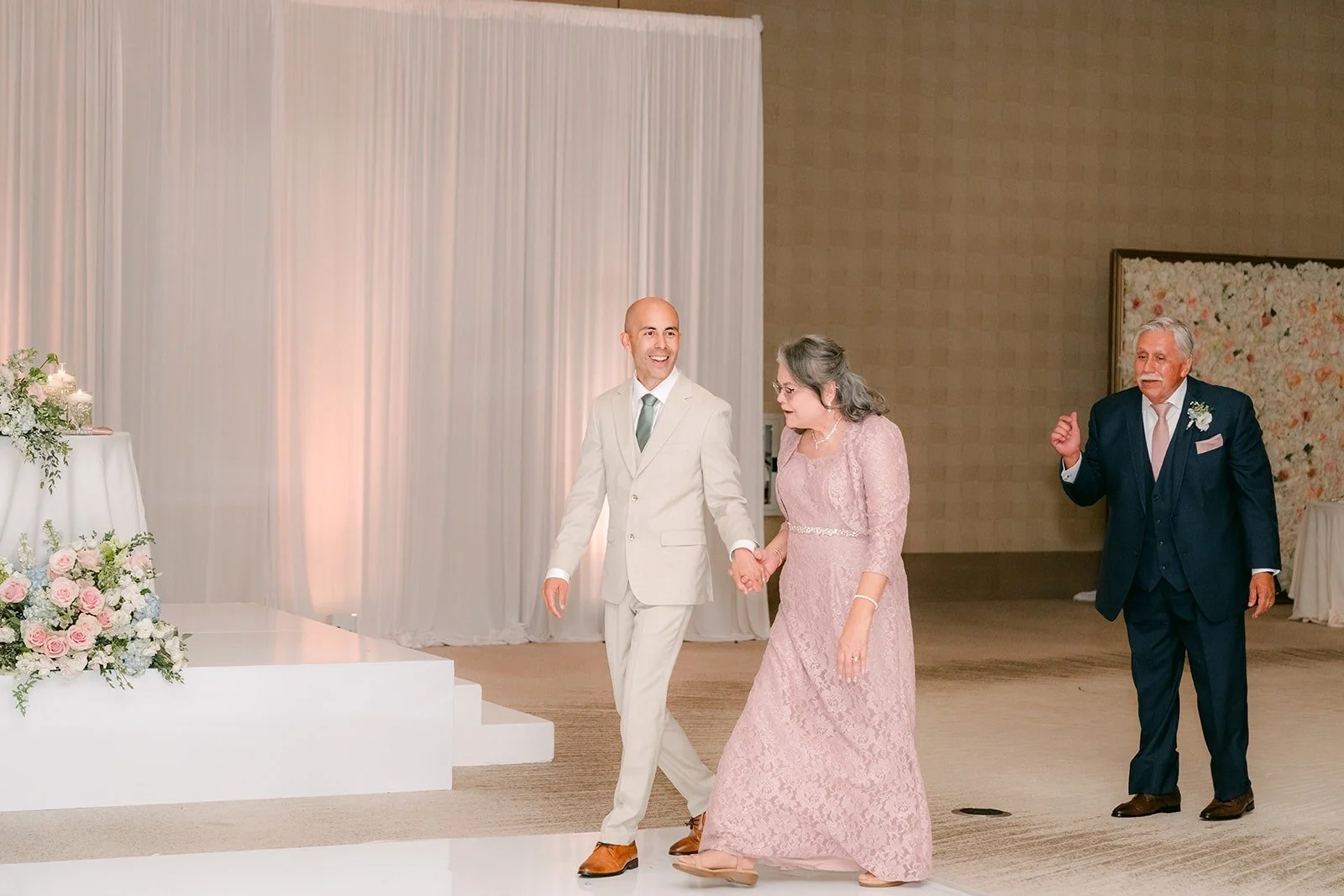 Daniel dances with a family member as guests look on