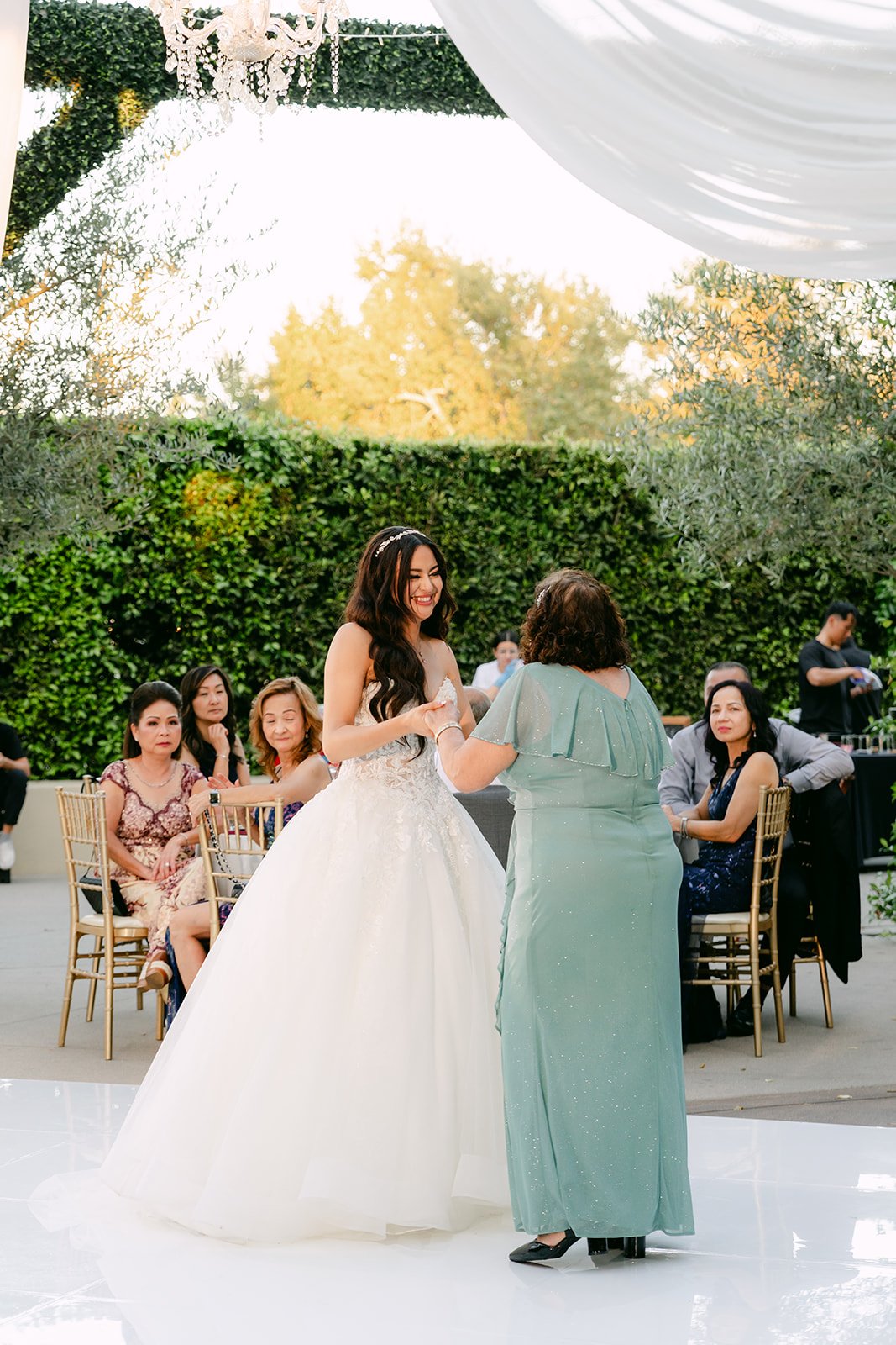 Sandra and her grandmother dancing to Hermoso Cariño, photographed by One and Only Production.