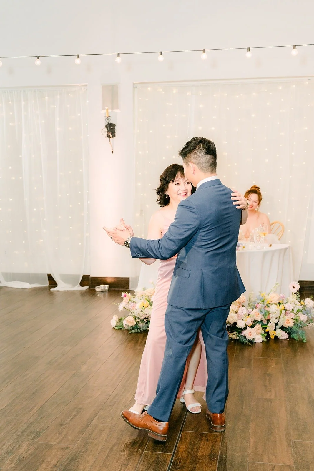 Jerrick sharing a parent dance on the dance floor