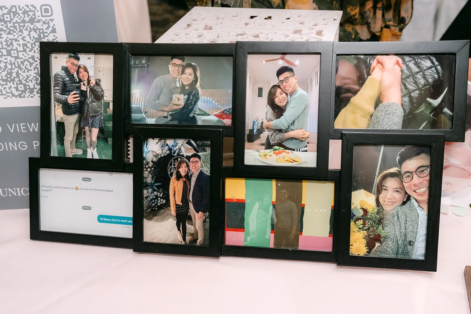 A table of framed photos of Eunice and Eric for guests to see
