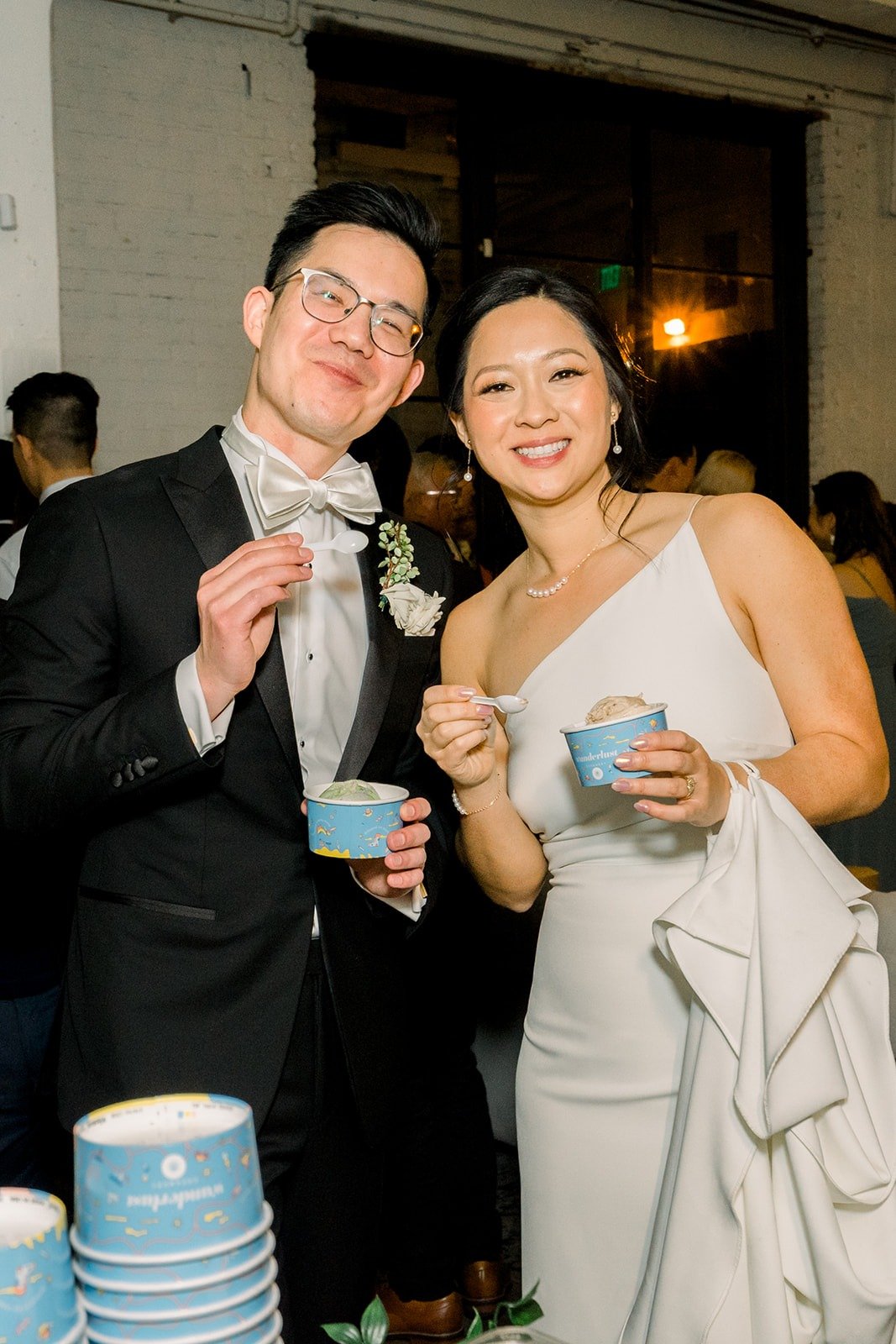 Cindy and Alex laughing with their ice cream cups