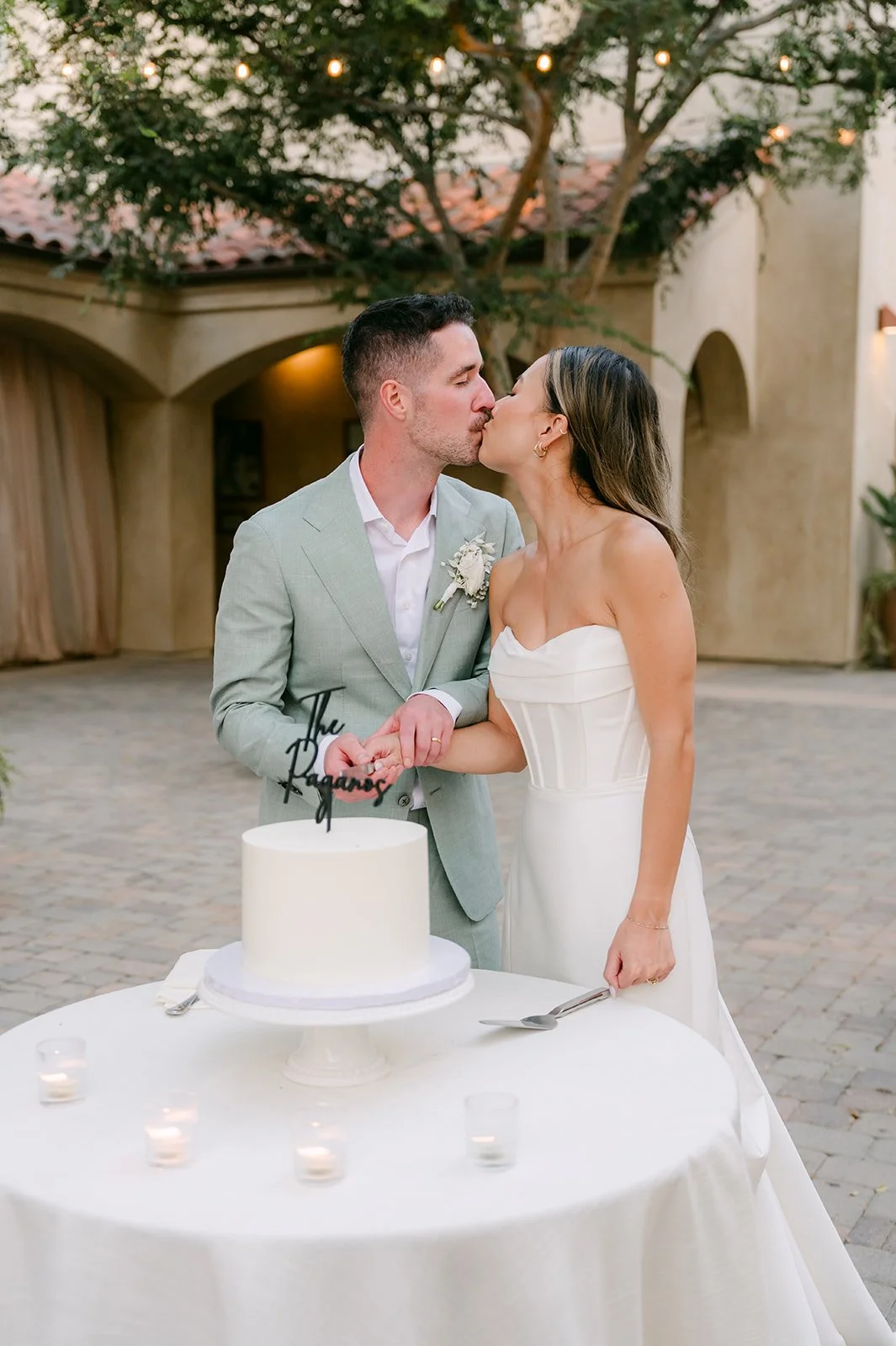 Kieu and Anthony cutting their cake
