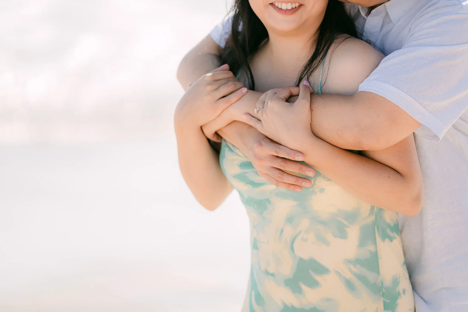 Close-up of Lawrence hugging Constance from behind.