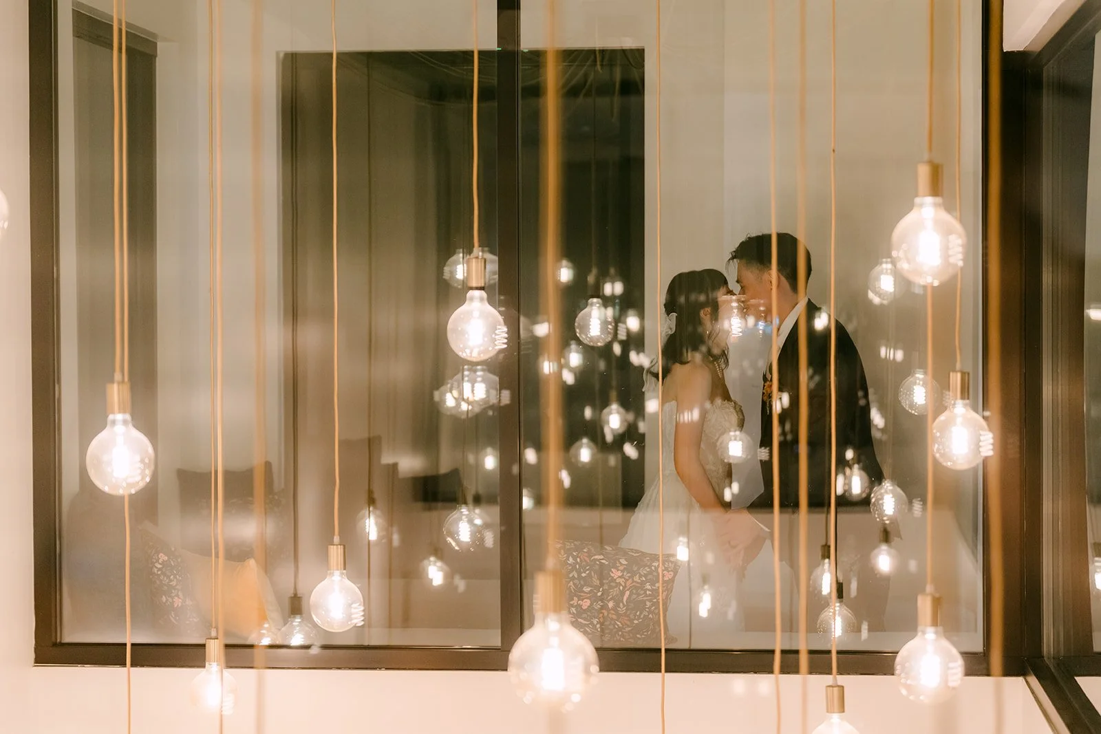 Night portrait among the hanging globe lights