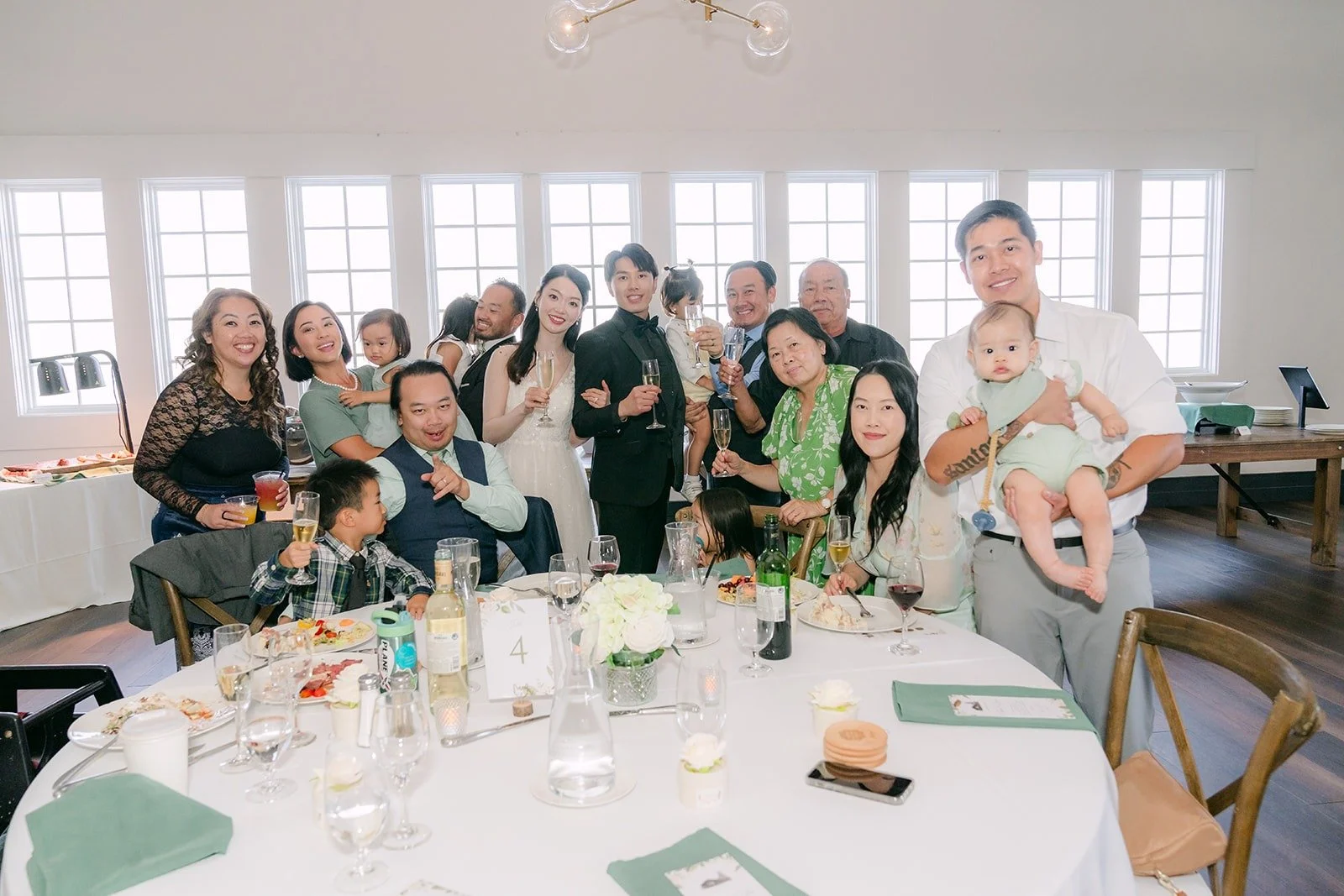 A full table raising a toast