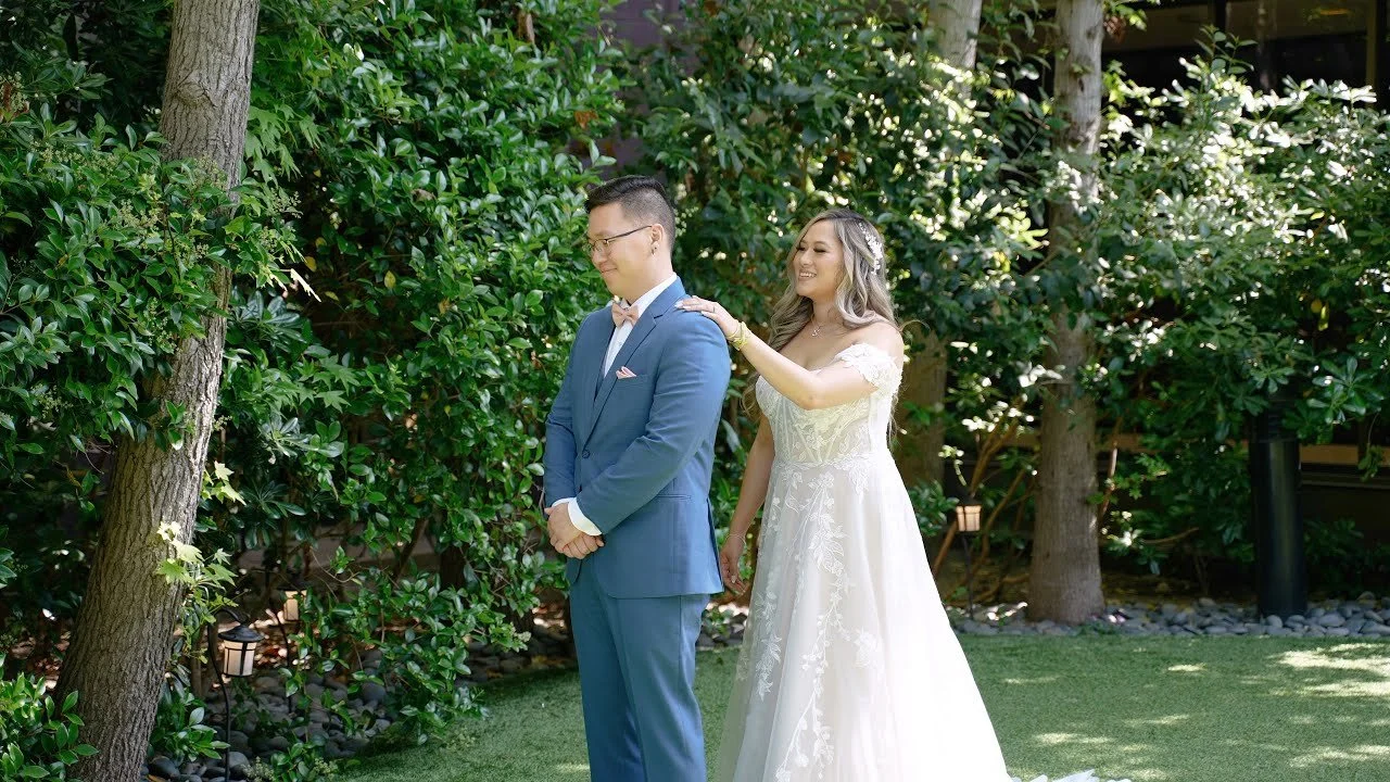 Video still of Somrennah and Jaemin's first look surrounded by greenery