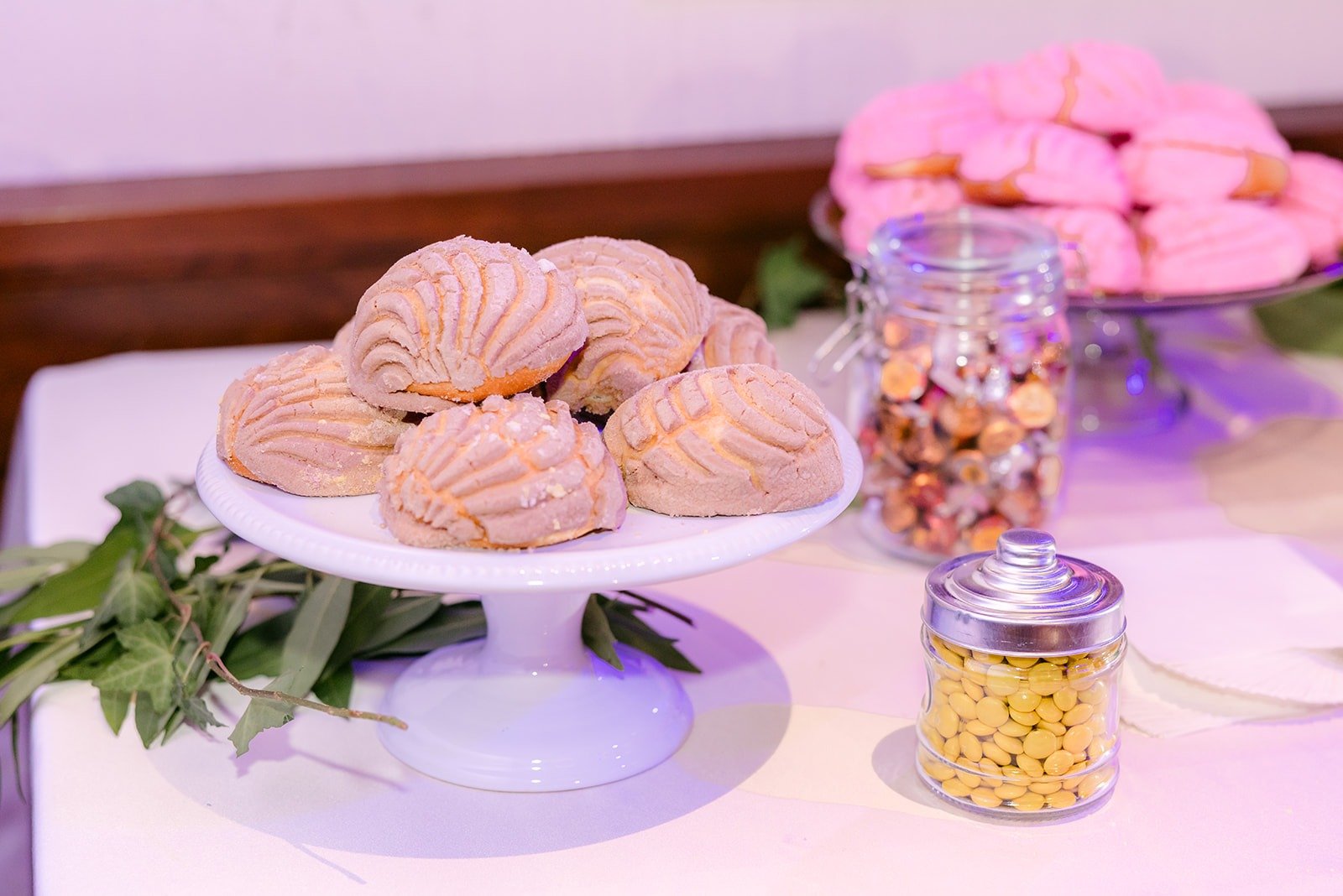 Conchas and treats on the dessert table, photographed by One and Only Production