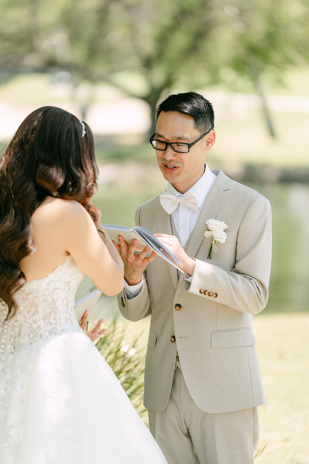Kevin reading his vows to Sandra by the lake.
