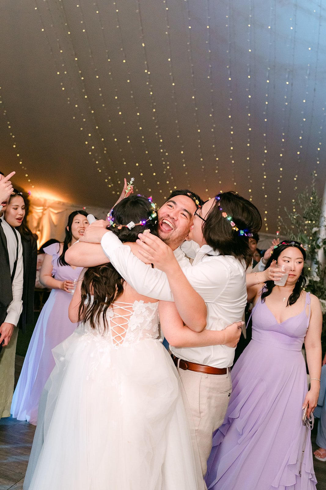 Kat and Mike hugging friends on the dance floor
