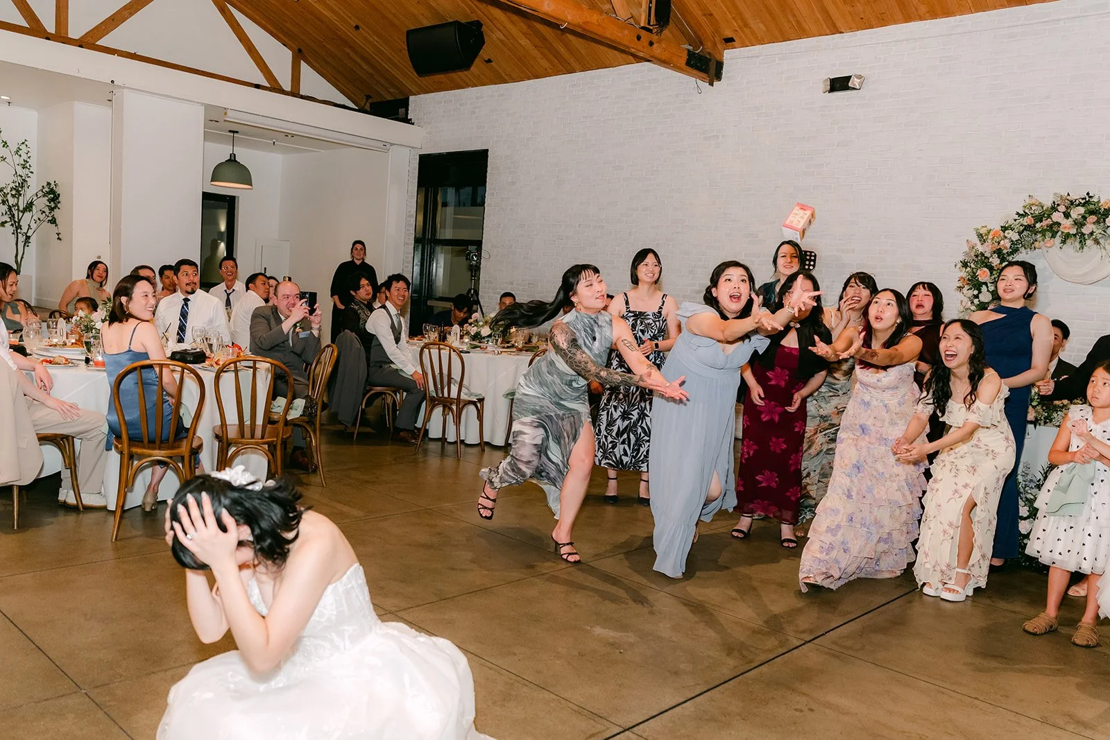 Guests reaching for the blind box