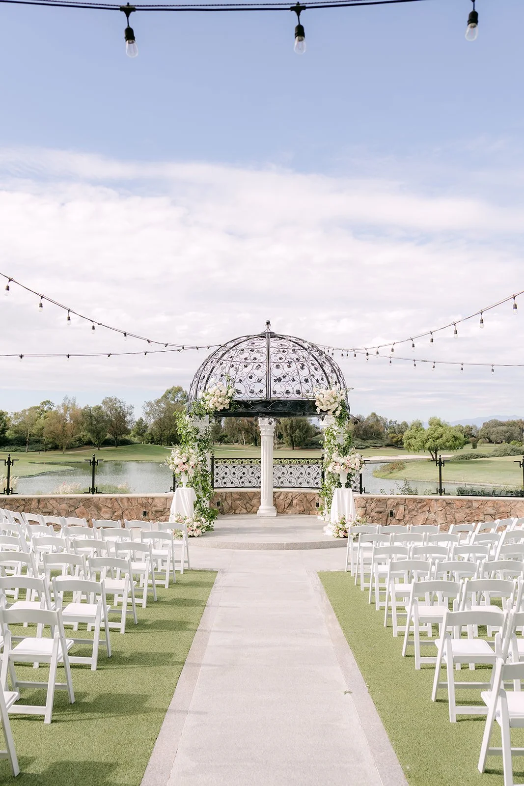 Ceremony aisle leading to the iron gazebo at Old Ranch Country Club