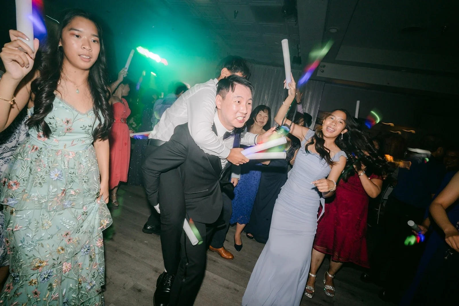 Glow sticks and colored lights on the dance floor