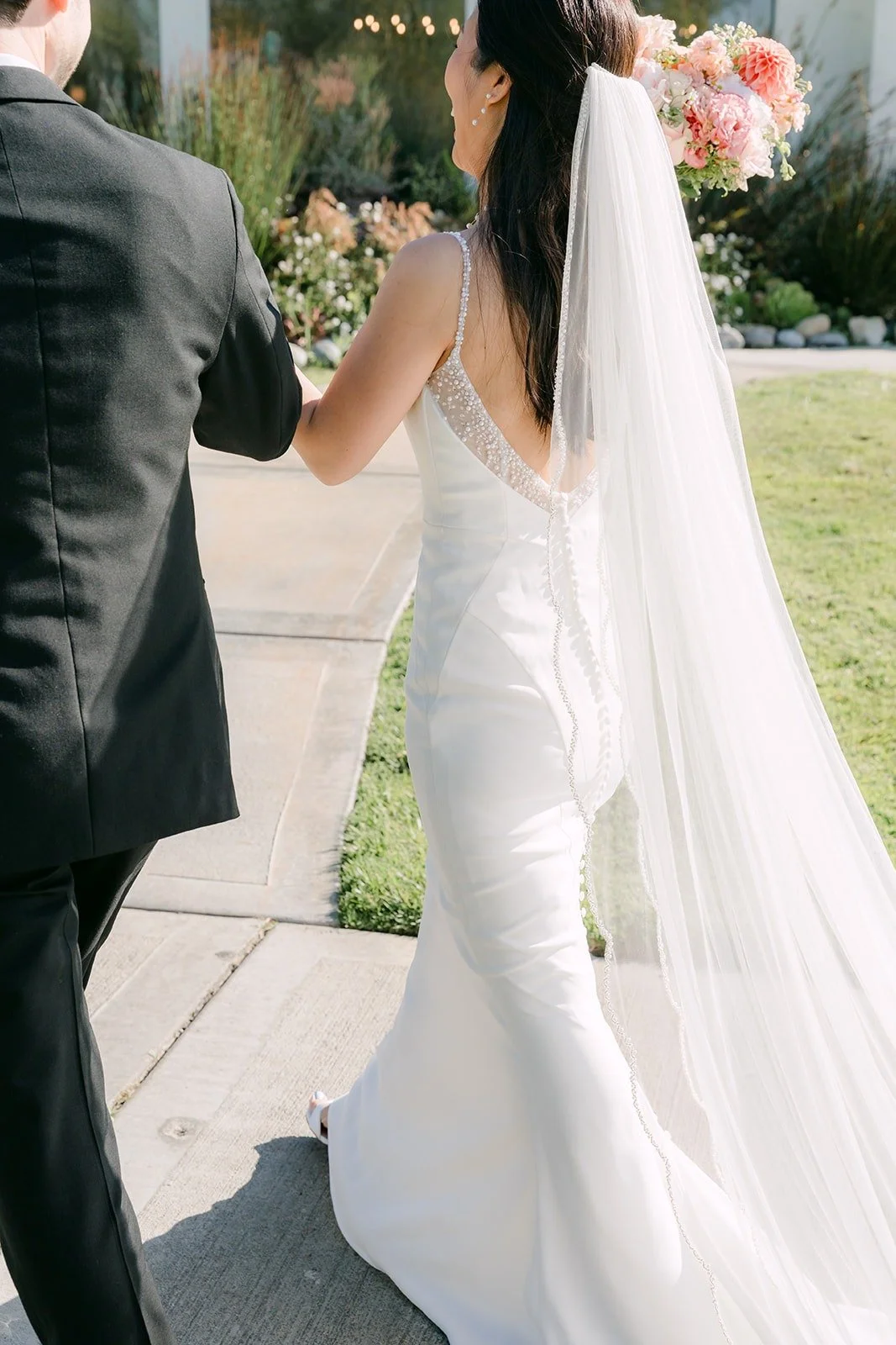 Stephanie and Kevin heading back up the aisle as newlyweds, photographed by One and Only Production