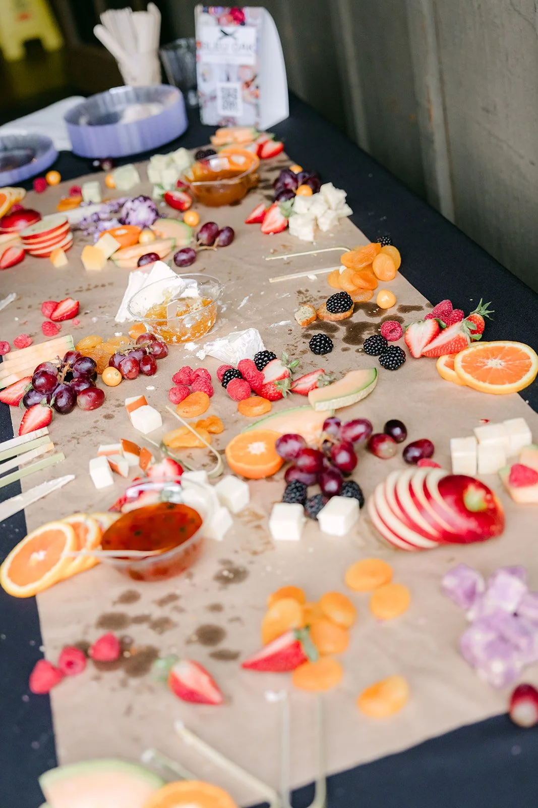 Grazing table with fresh fruit, cheese and charcuterie