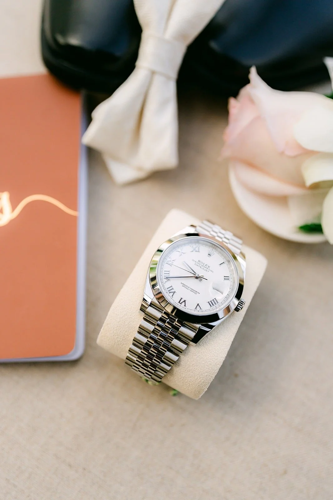 Chungman's watch, vow book and white bow tie
