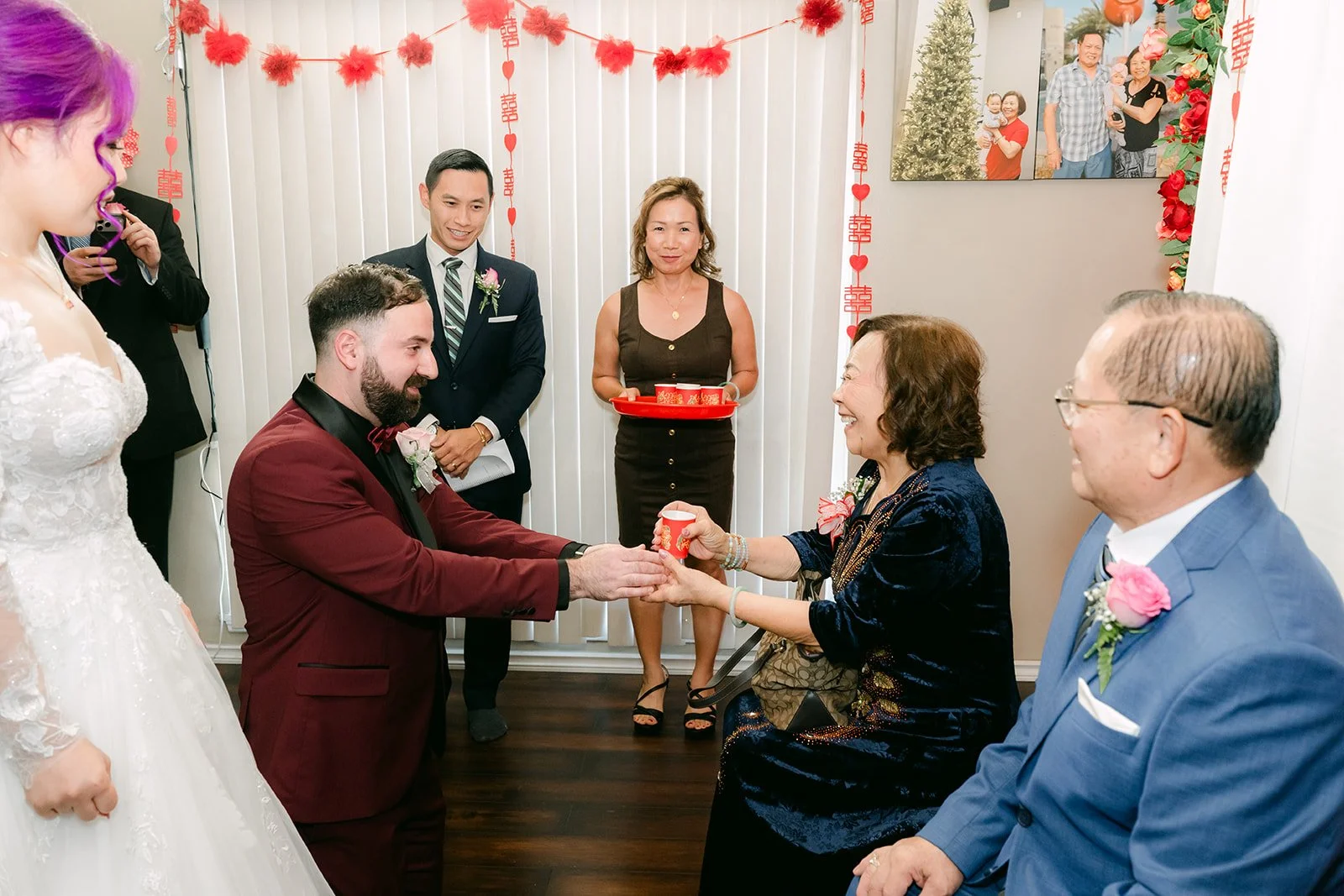 Vanessa and Ryan serving tea to Vanessa's parents.