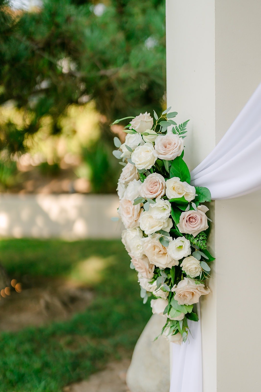 White roses and draping on the ceremony gazebo