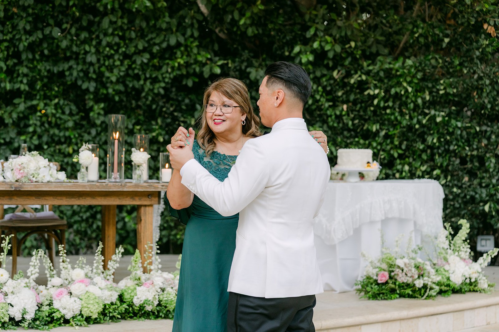 Caryl dancing with his mom during the parent dances.