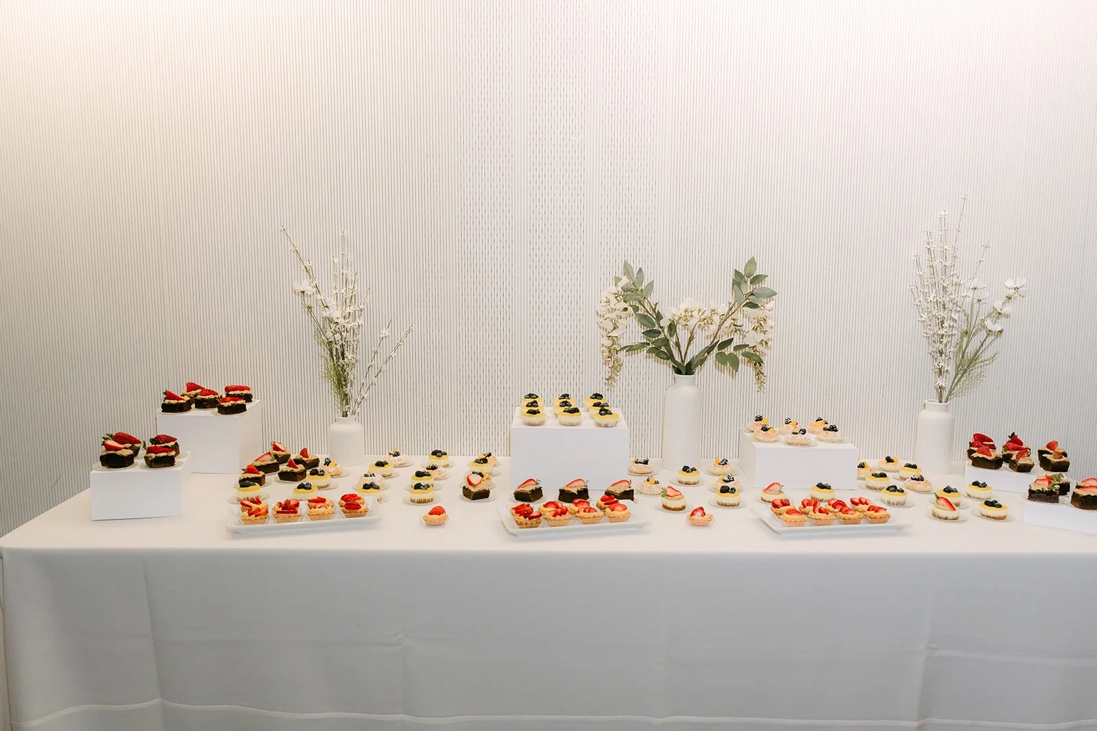 The dessert table set with sweets.