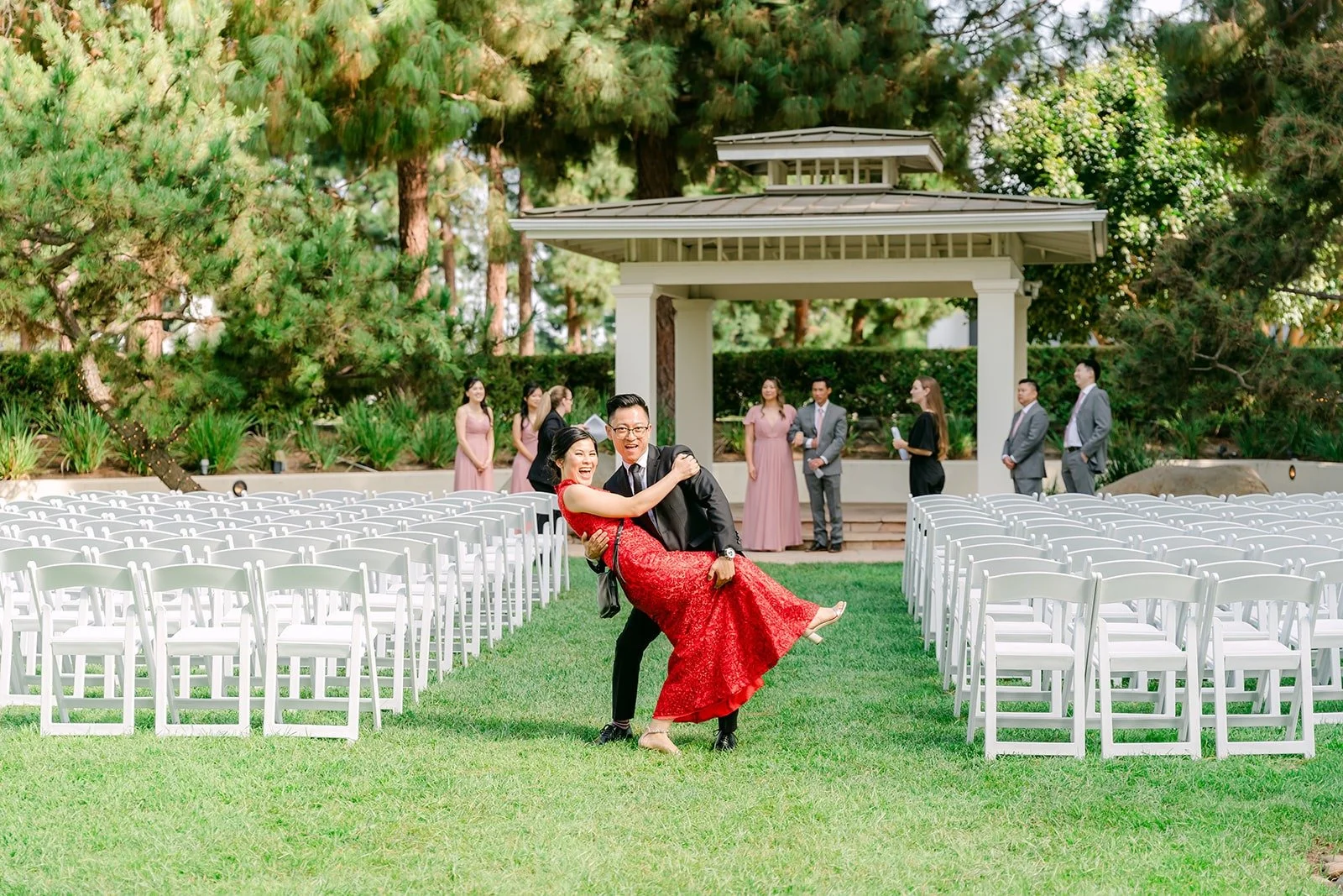 Ceremony seating facing the white gazebo on the lawn at the Turnip Rose