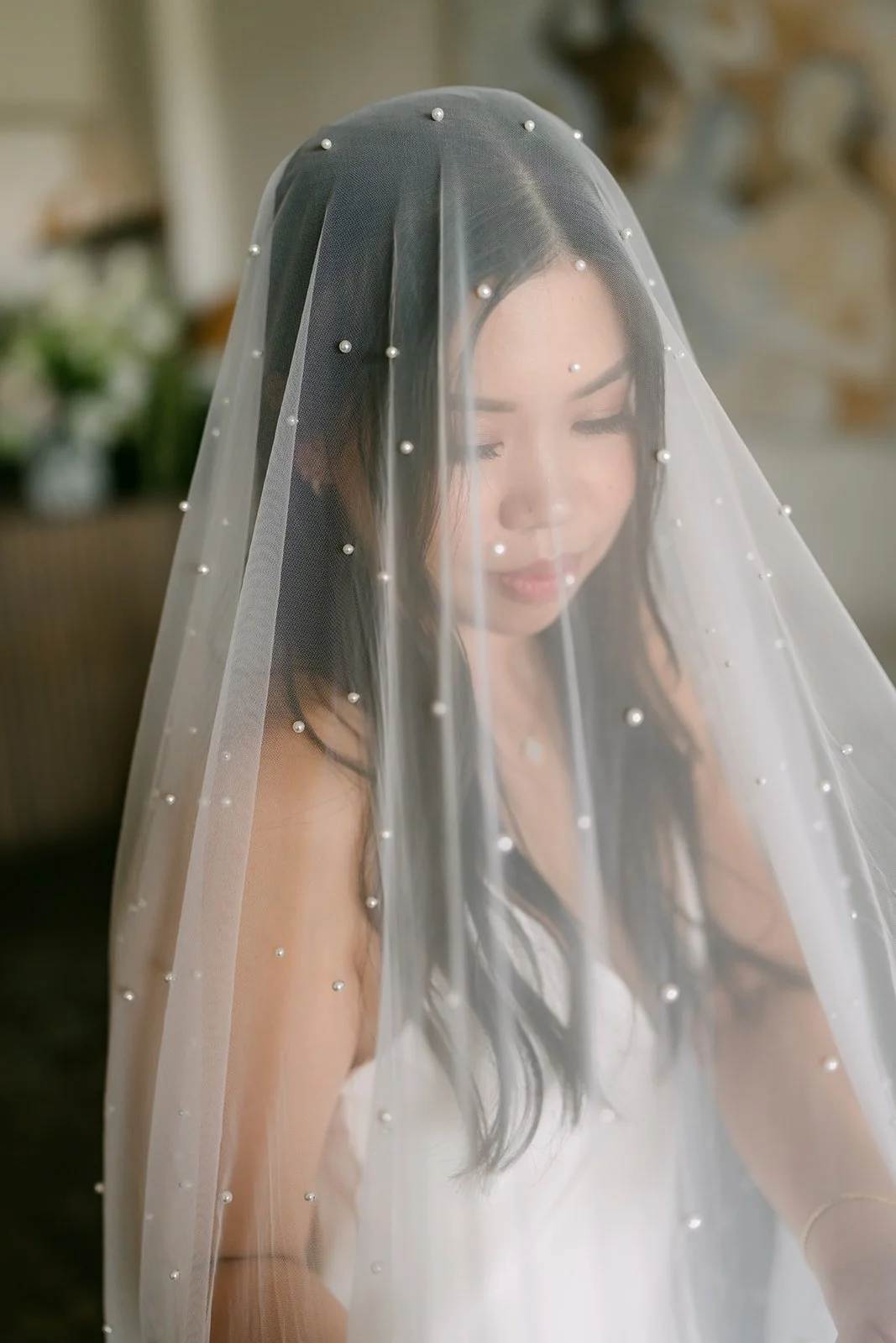 A soft portrait through the pearl veil