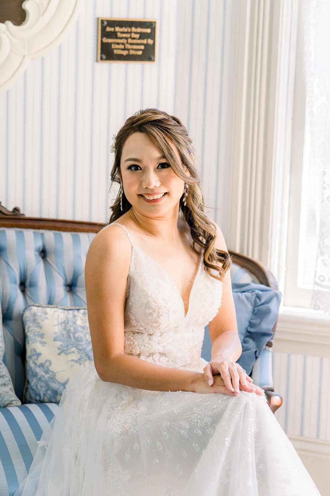 Ariel in her gown on the blue settee