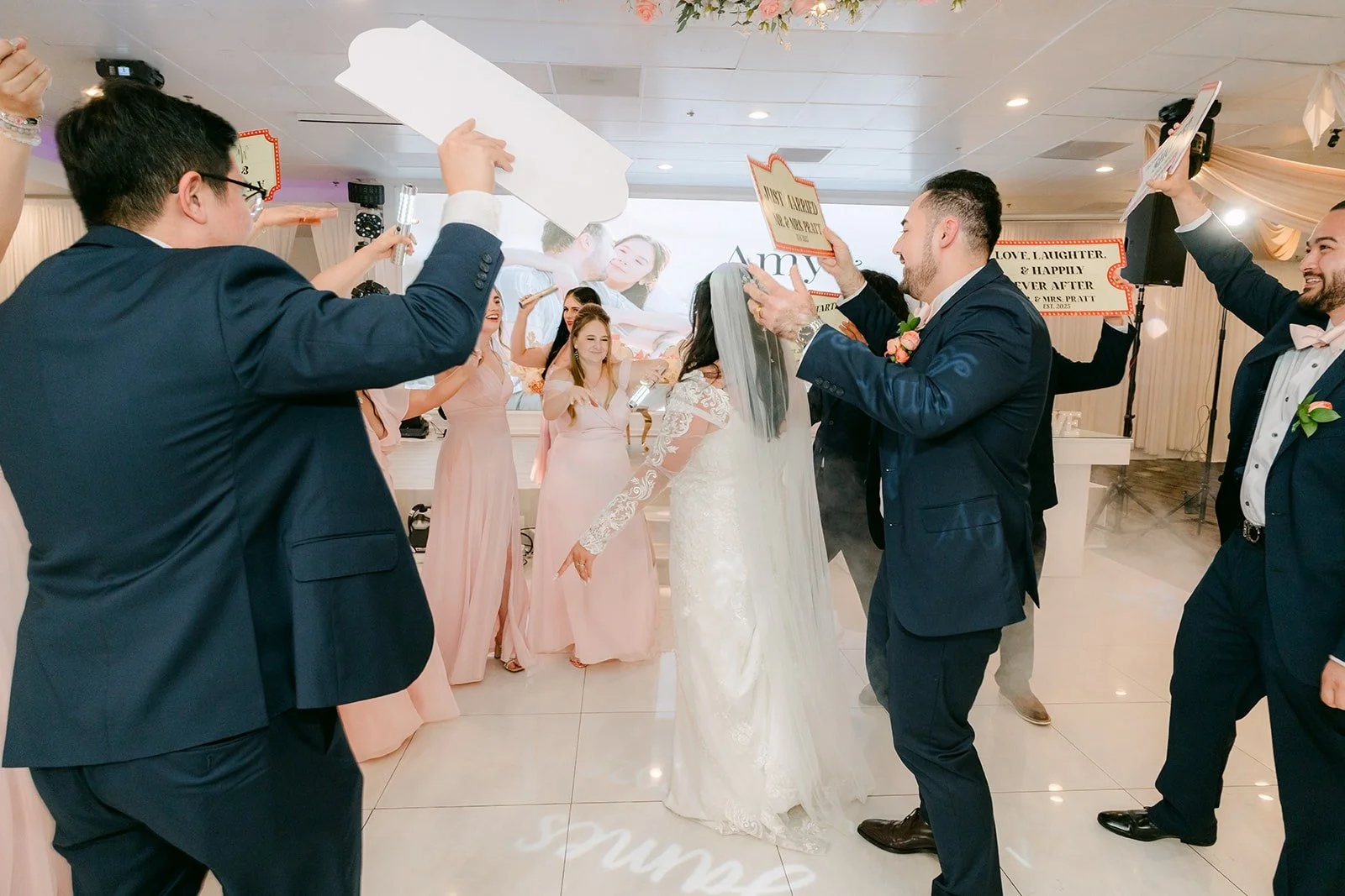 Groomsmen hyping up the crowd during the grand entrance
