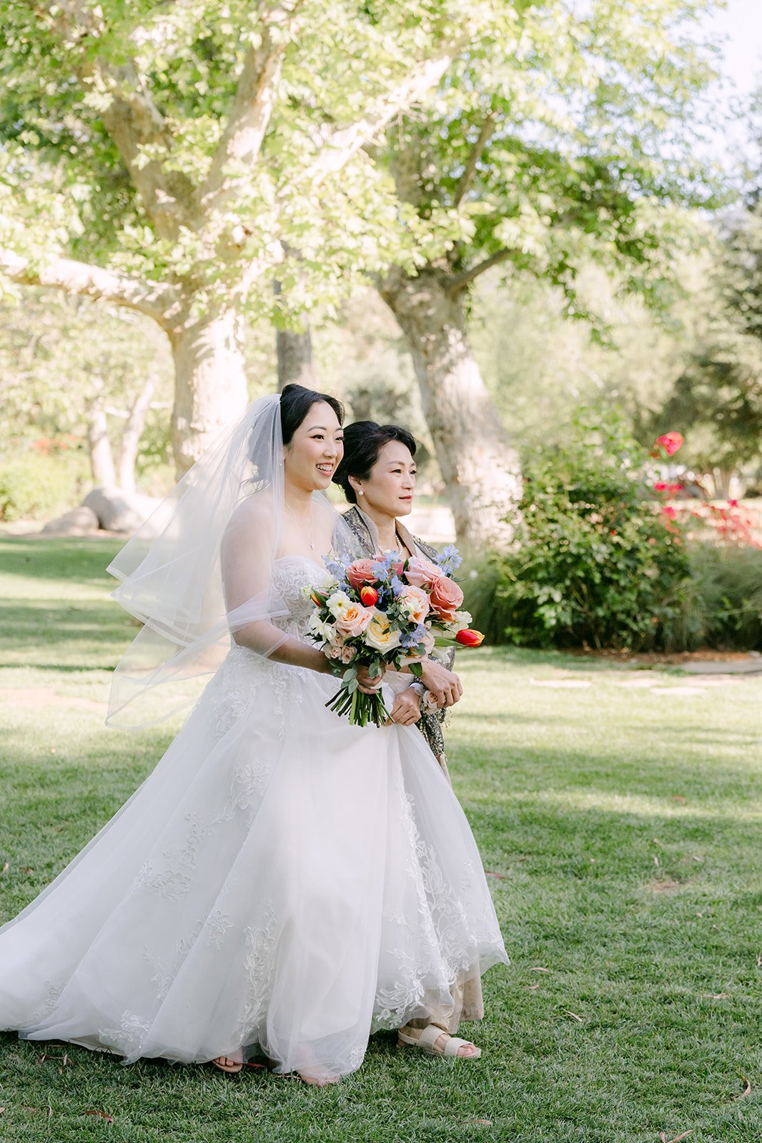 Yishan walking down the aisle with her bouquet