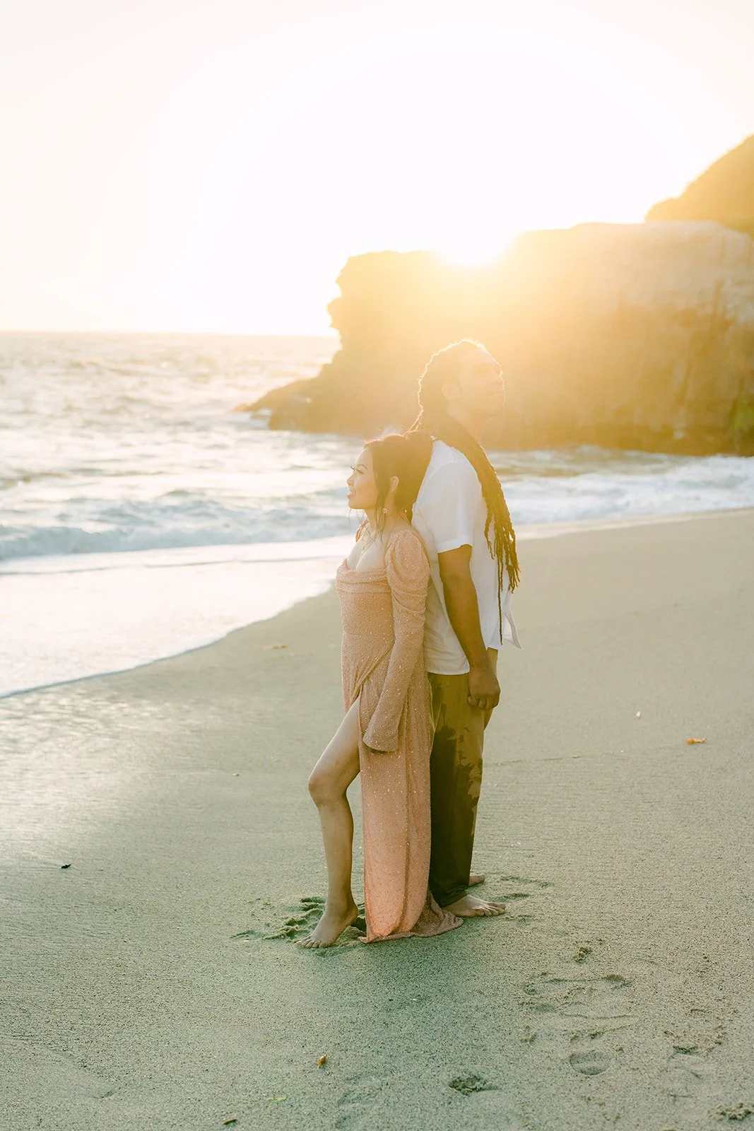 Amy and Michael silhouetted against the setting sun.