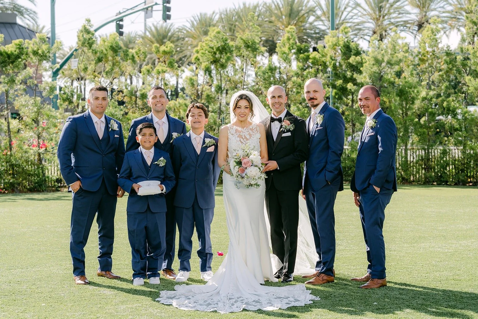 Daniel and his groomsmen in navy suits with Francesca