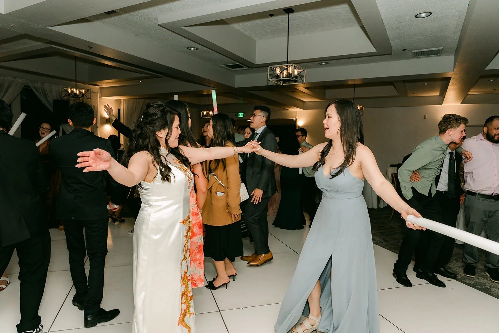 Guests dancing in a circle around Florence