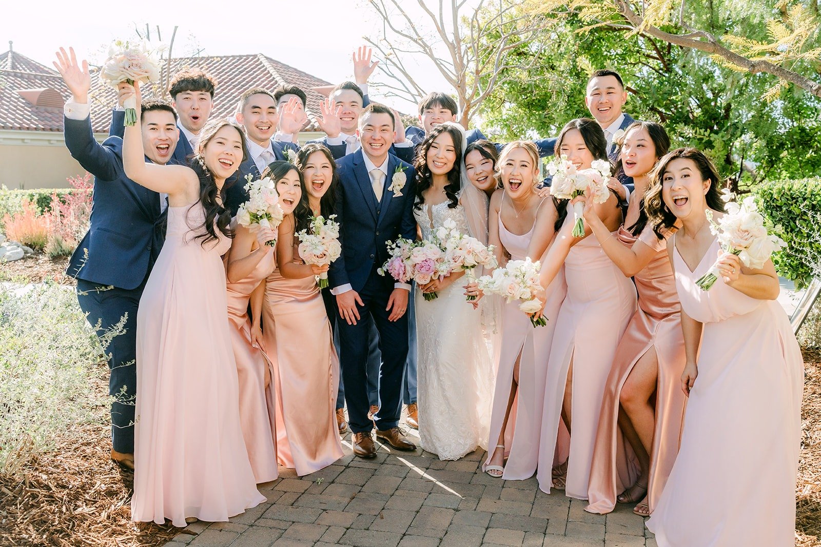 Kelli and Alex celebrating with the wedding party right after the ceremony, photographed by One and Only Production