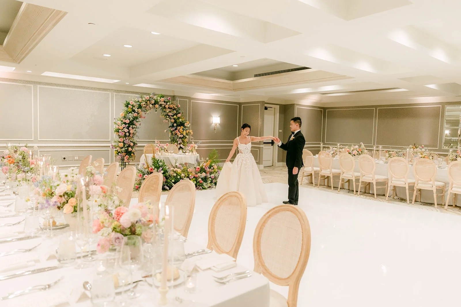 A wide view of Kylie and Mario in the finished ballroom before the reception, photographed by One and Only Production