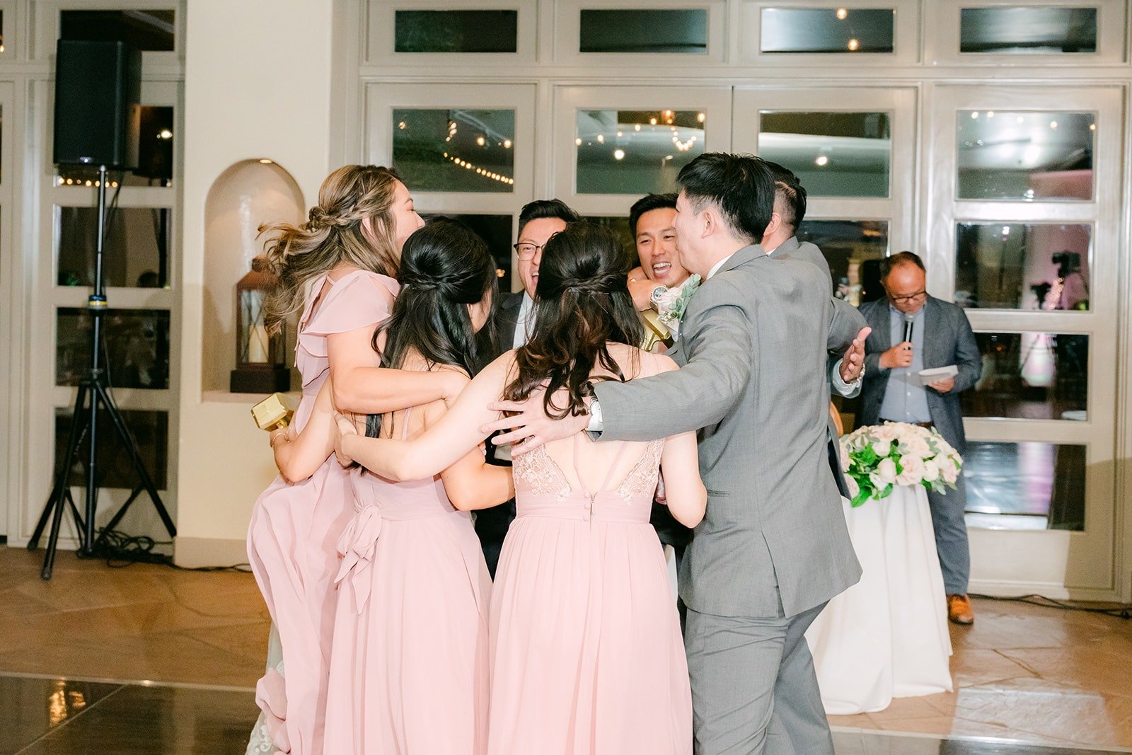 Bridesmaids and groomsmen celebrating on the dance floor