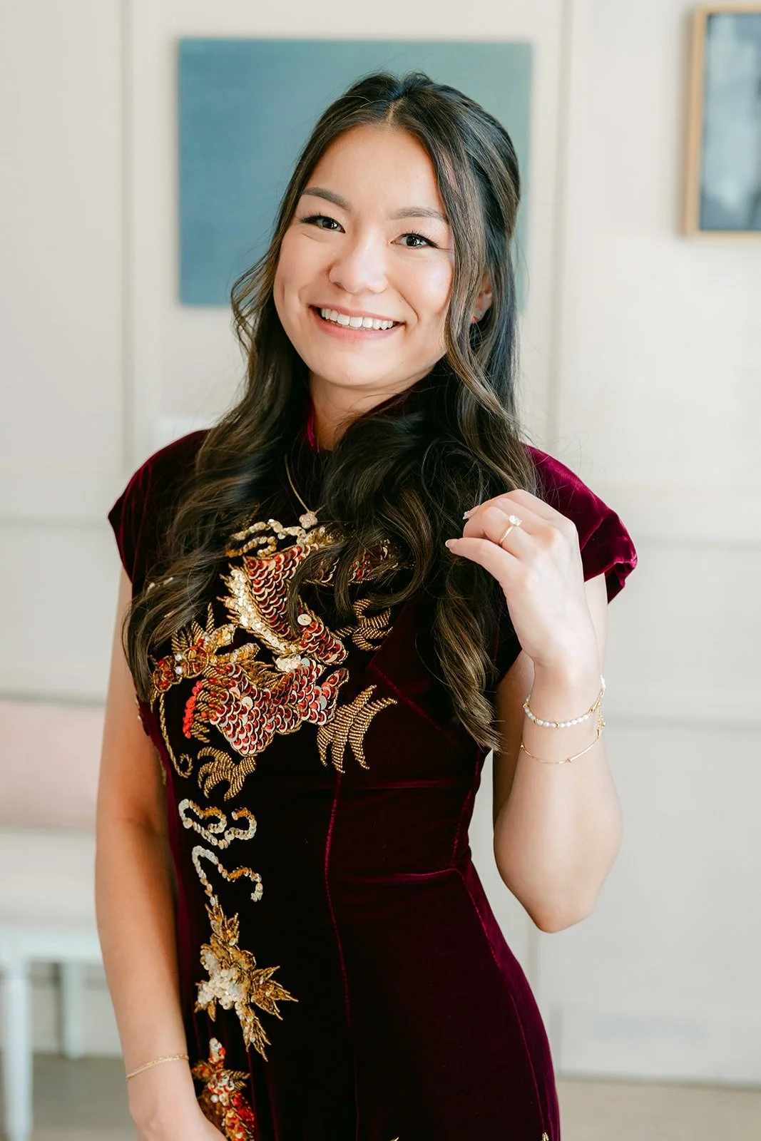 Jadee smiling in her embroidered qipao