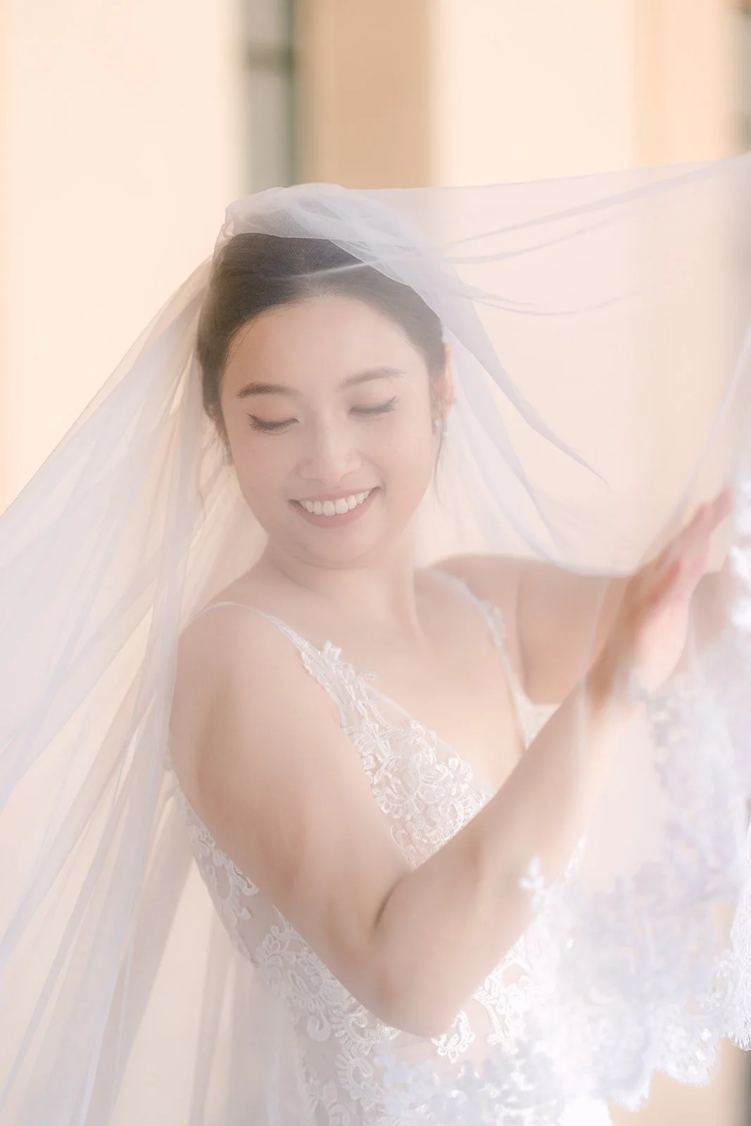 Elisa smiles through her veil