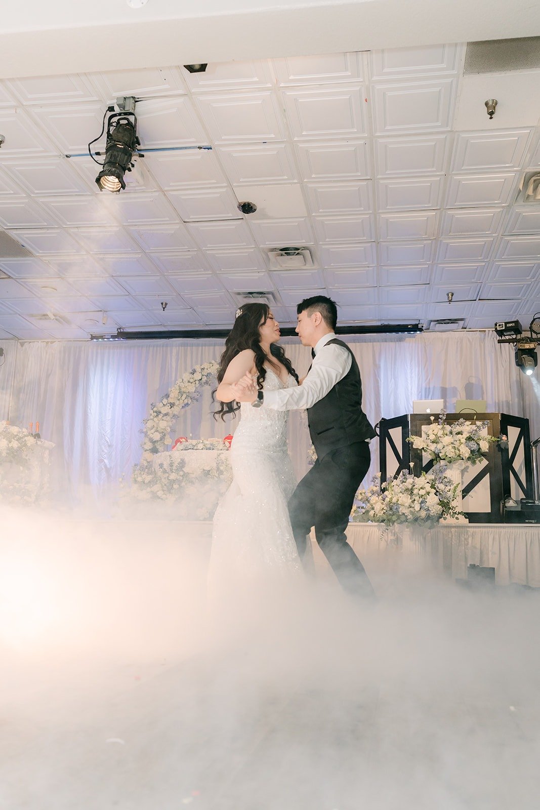 Emily and James dancing on a cloud of fog