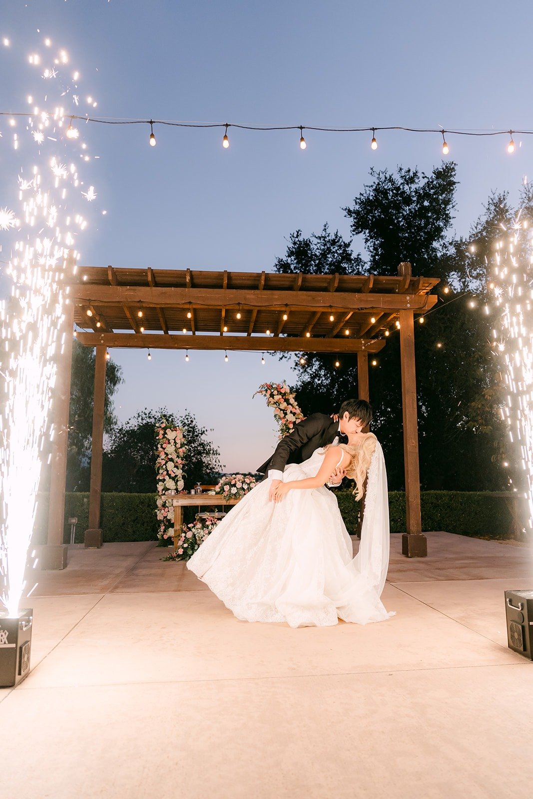 Job dipping Konitha as cold spark fountains light up the dance floor