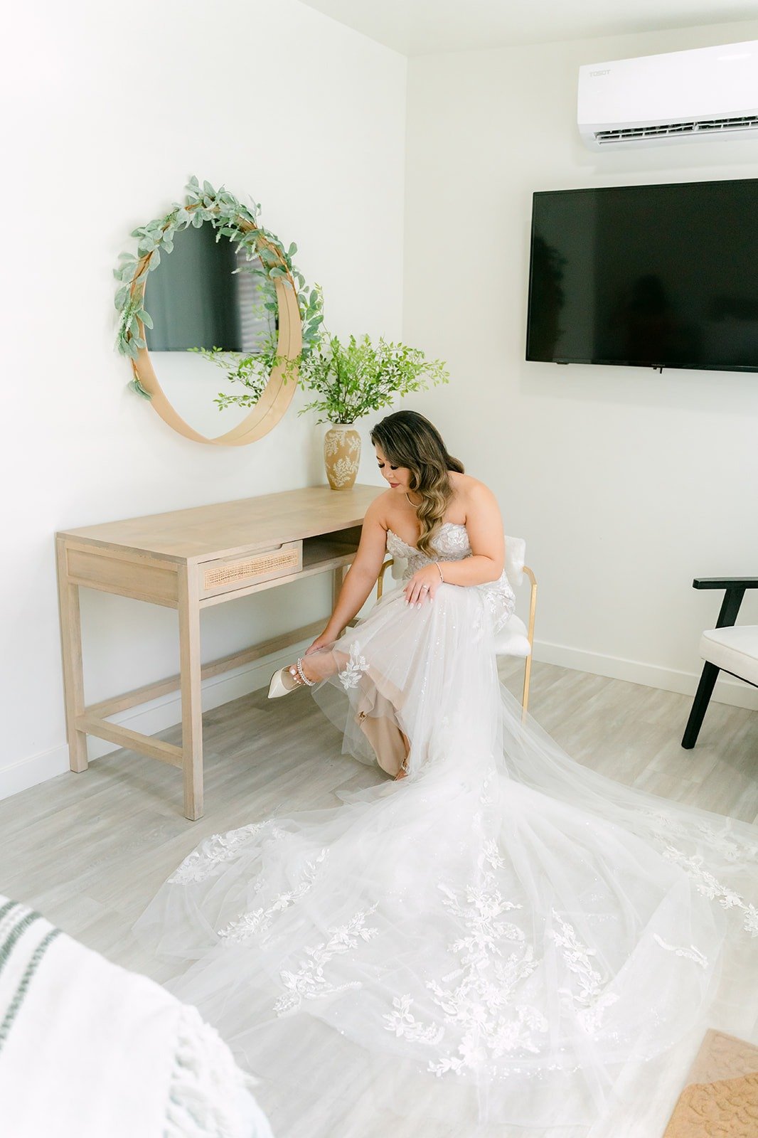 Candice in her gown with her long train across the floor