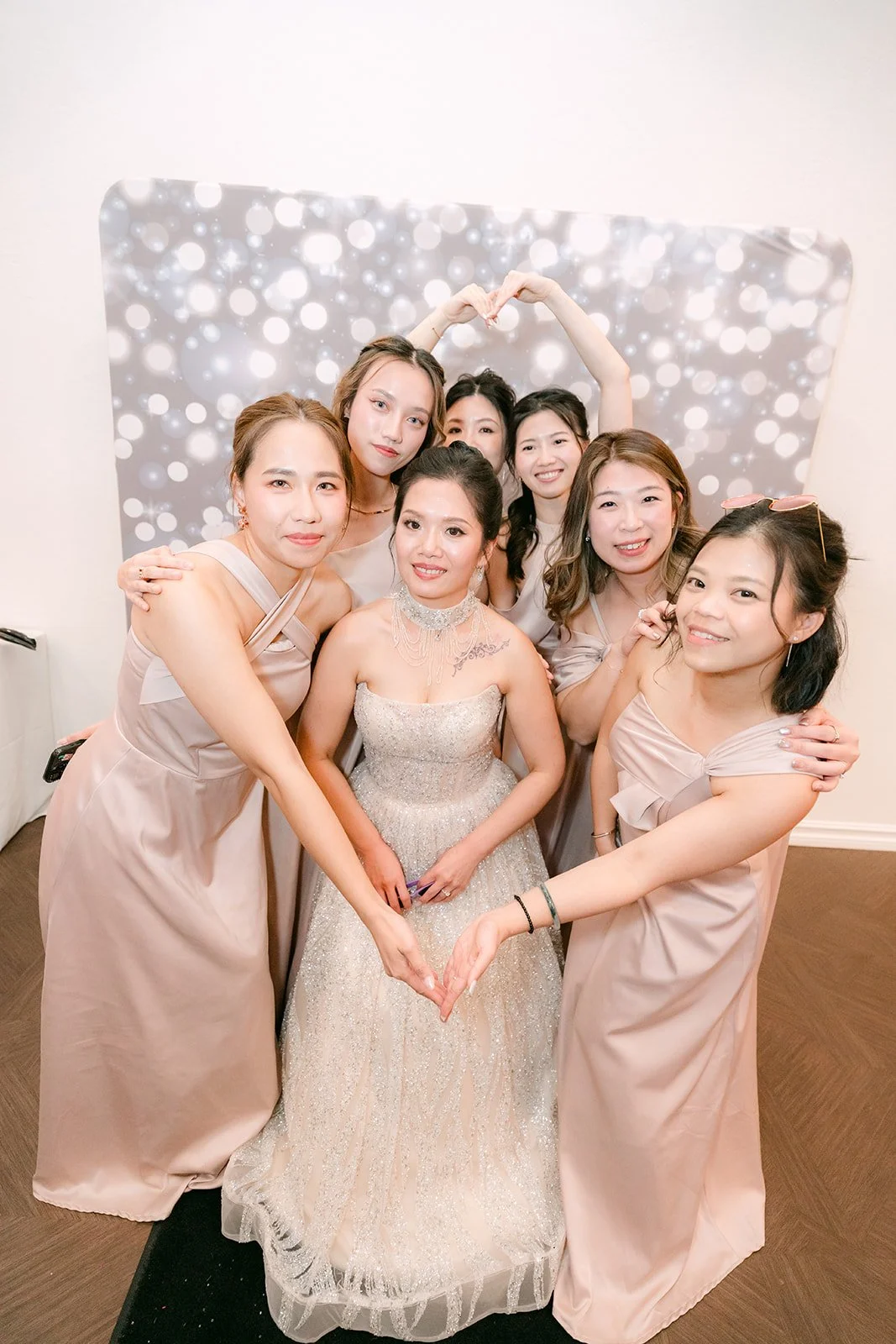 Kate and her bridesmaids posing at the photo booth.